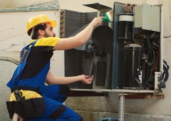 outdoor ac tech working